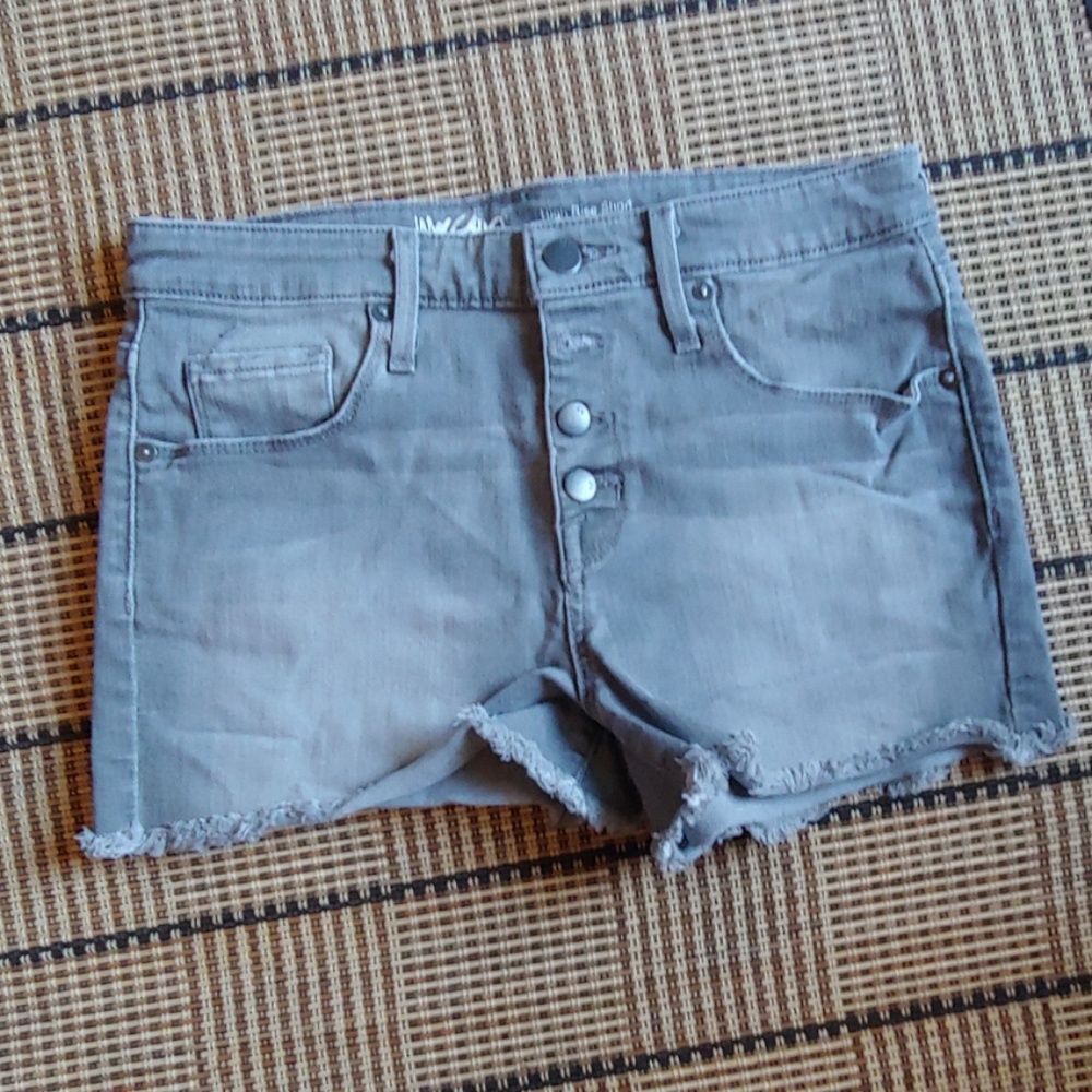 Grey jean shorts with four buttons on front
